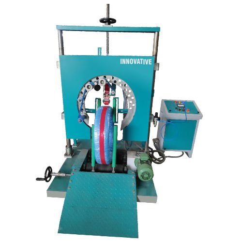 Coil wrapping machine manufactured by Innovative WrapTech Pvt. Ltd. for industrial packaging