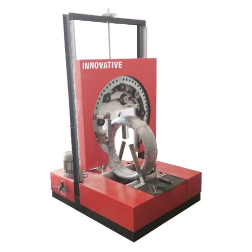 GI wire film wrapping machine wrapping galvanized iron wire coils with protective stretch film in an industrial facility