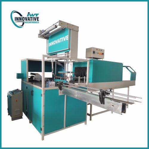Paper board shrink wrapping machine wrapping stacked paper boards with shrink film