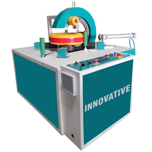 Brass coil stretch wrapping machine wrapping brass metal coils with protective stretch film in an industrial plant