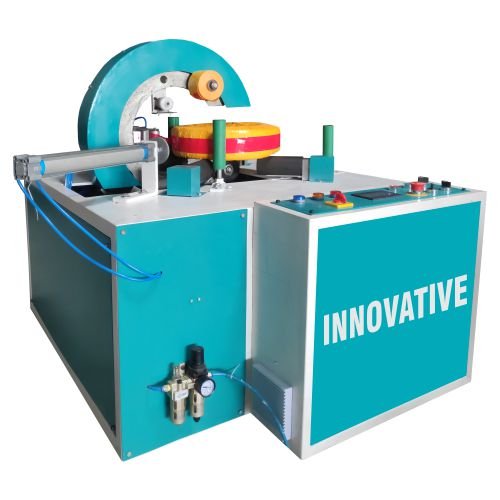Hose pipe wrapping machine packing flexible hose pipes with stretch film in an industrial facility