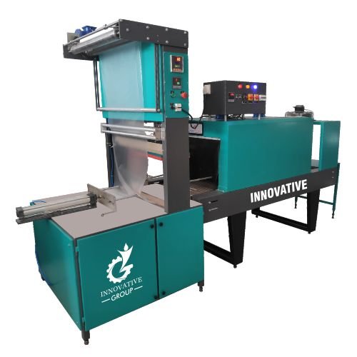Shrink wrapping machine sealing MiG wire spools with heat shrink film for secure industrial packaging