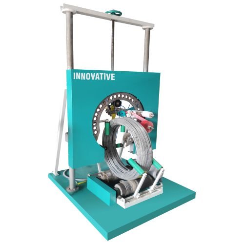 SS wire coil packing machine wrapping stainless steel wire coils with protective stretch film in an industrial plant