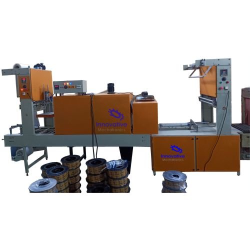 High-Speed Shrink Wrapping Machine by Innovative WrapTech Pvt. Ltd. in industrial packaging setup, showing conveyor-fed products with shrink film sealing and heat tunnel.