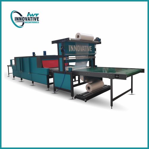 Industrial shrink wrapping and packing machine automatically packaging bottles, cartons, and multipacks in a factory production line