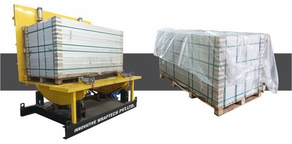 Industrial hydraulic coil tilter and tilting machine rotating heavy steel coils on a factory floor.